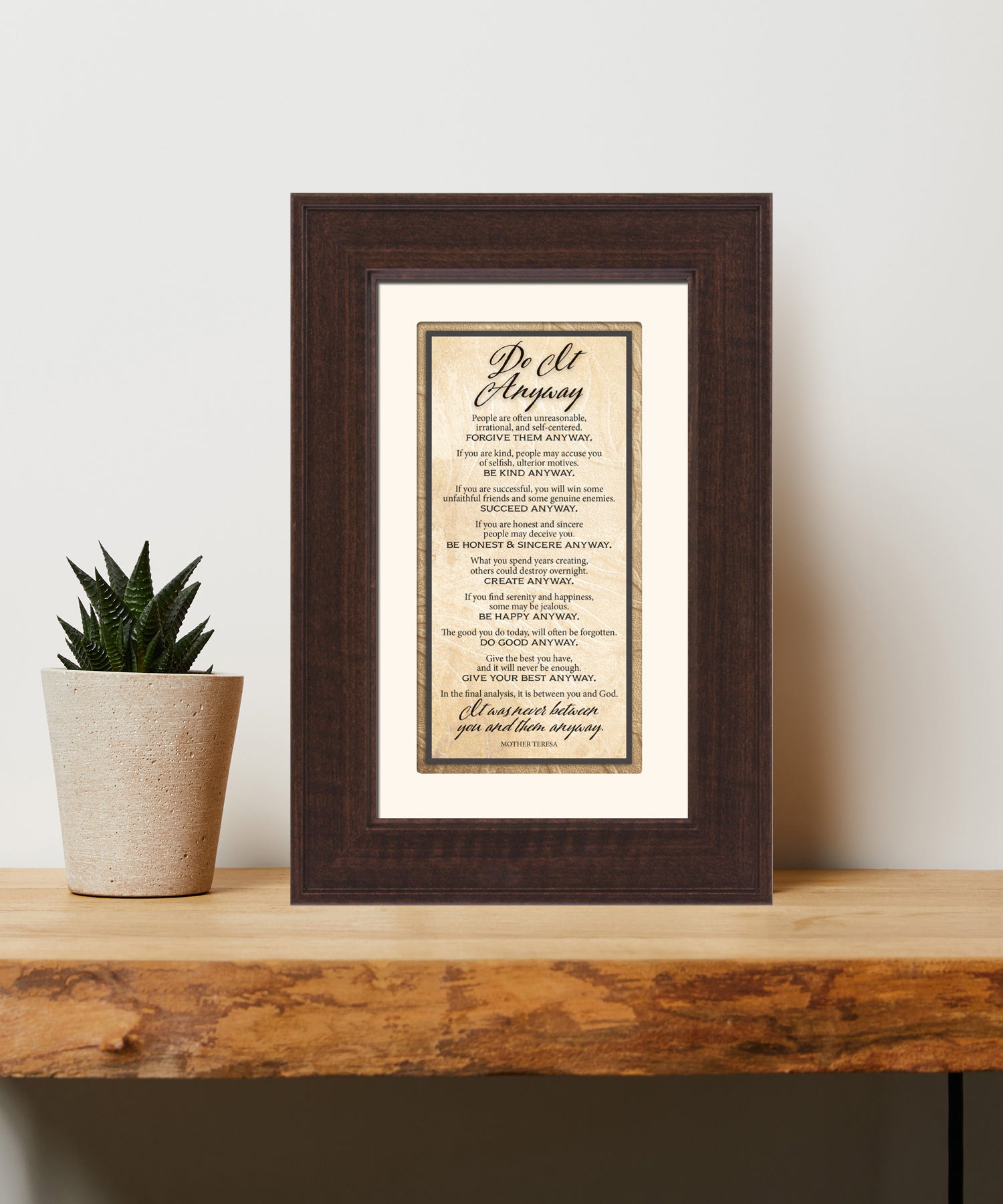 Do It Anyway Framed Art has elegant typography and a neutral design. It is framed in a classic wood frame with a warm finish and double matting.