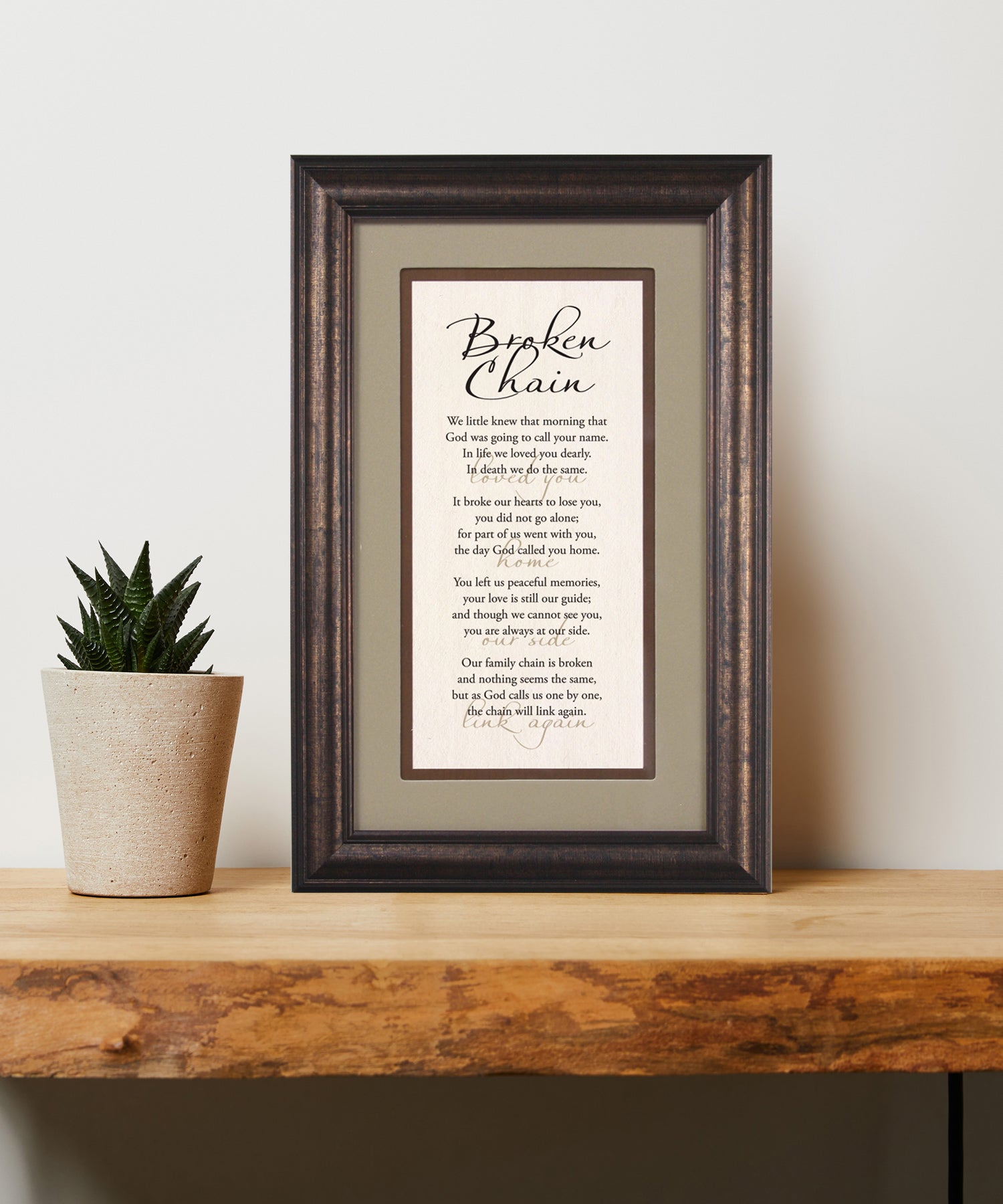 Broken Chain Framed Art has elegant typography and a neutral design. It is framed in a classic wood frame with a warm finish and double matting.