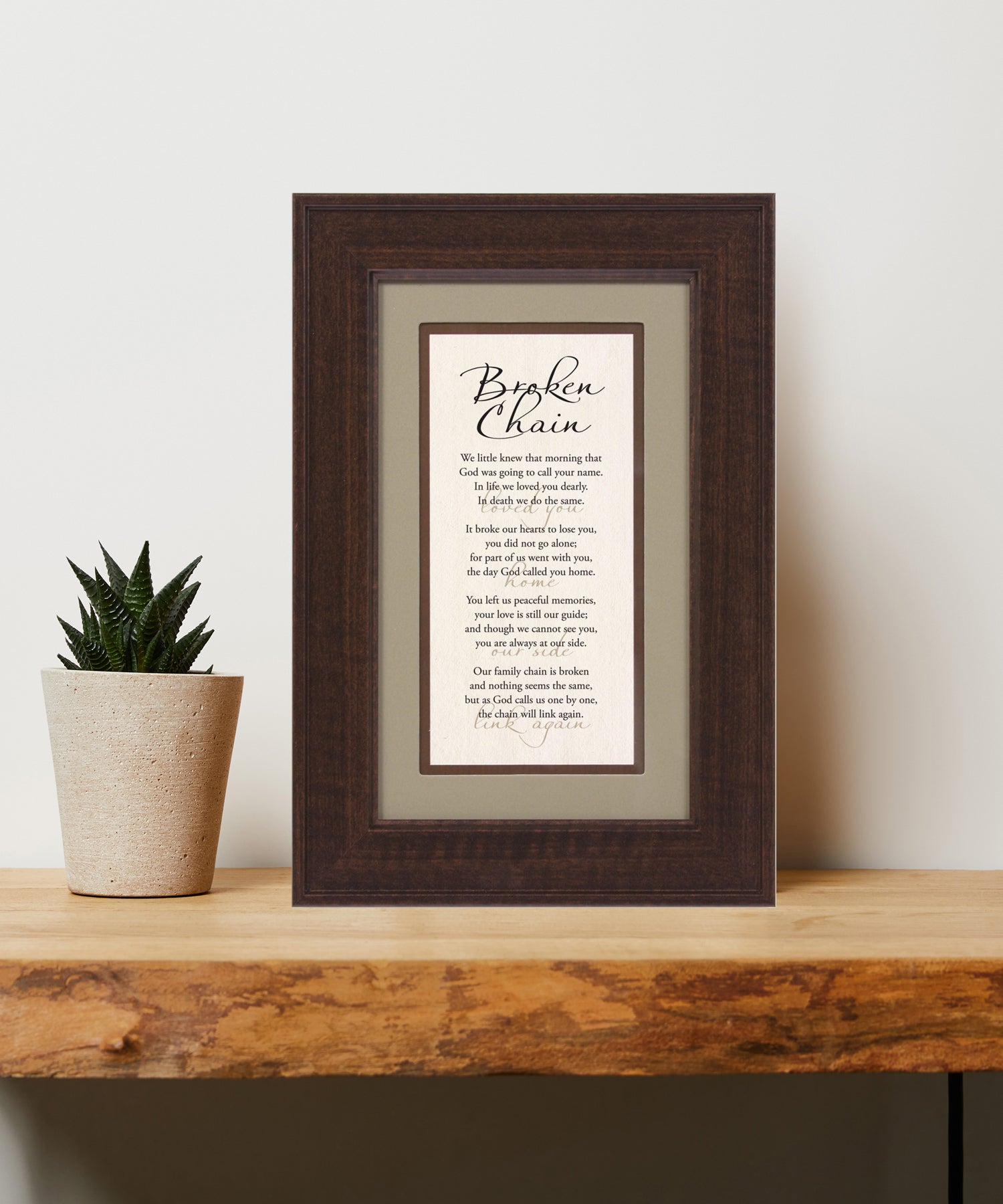 Broken Chain Framed Art has elegant typography and a neutral design. It is framed in a classic wood frame with a warm finish and double matting.
