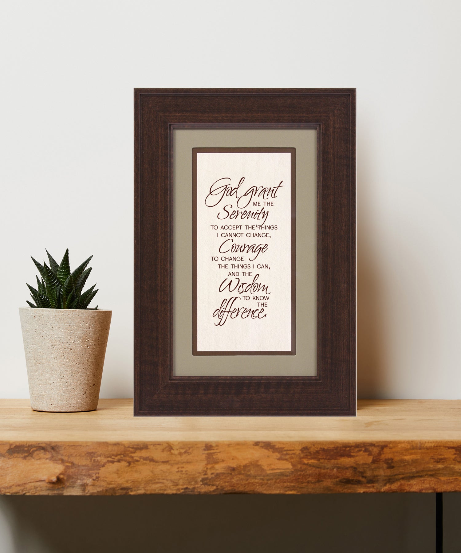 Serenity Prayer Framed Art has elegant typography and a neutral design. It is framed in a classic wood frame with a warm finish and double matting.