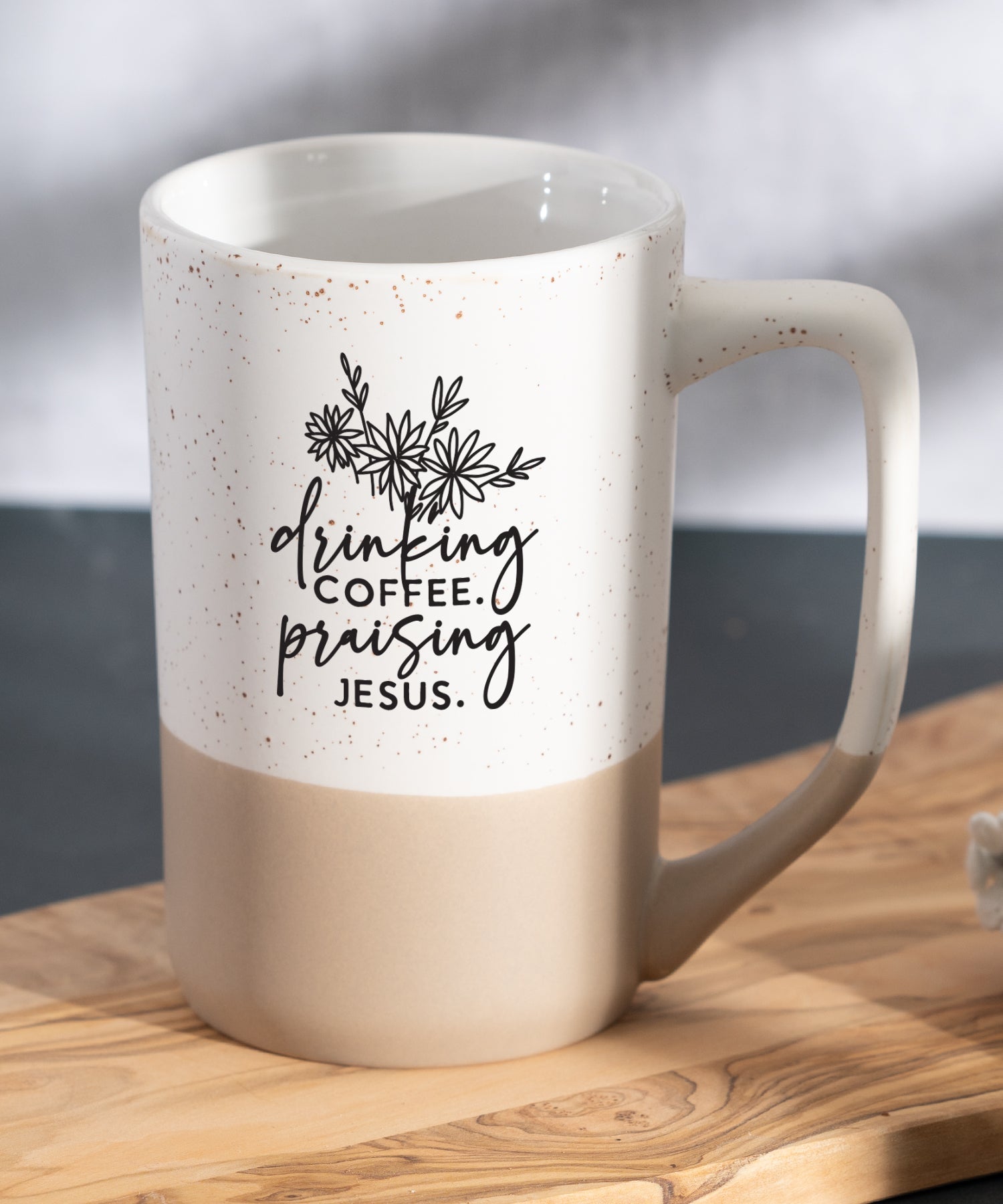 Drinking Coffee Praising Jesus Pebble Mug with speckled two-tone design and Christian message