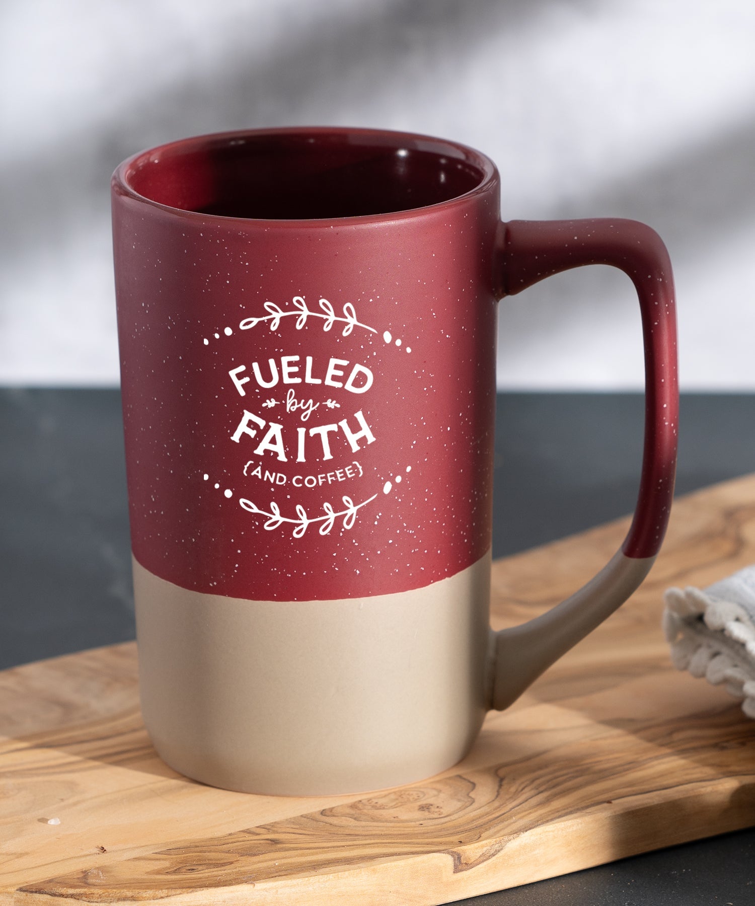 Fueled by Faith Pebble Mug with speckled two-tone design and Christian inspirational message