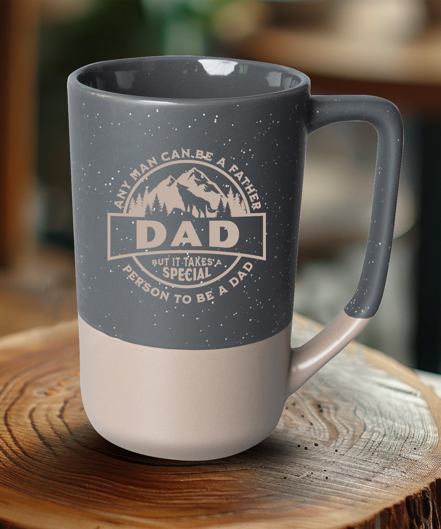 Two-toned ceramic mug with pebble accents featuring Any Man Can Be a Father and a corresponding image.