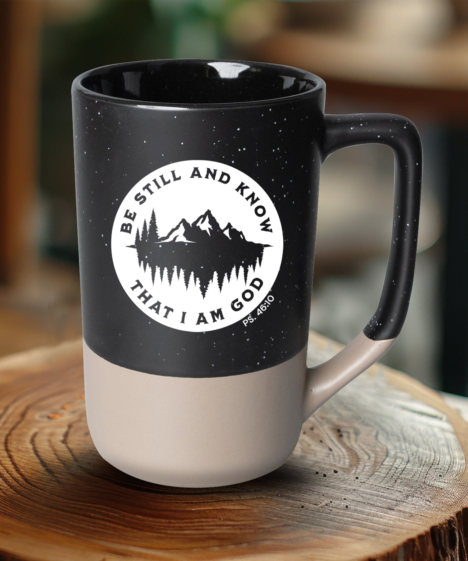 Two-toned ceramic mug with pebble accents featuring Be Still and Know and a corresponding image.