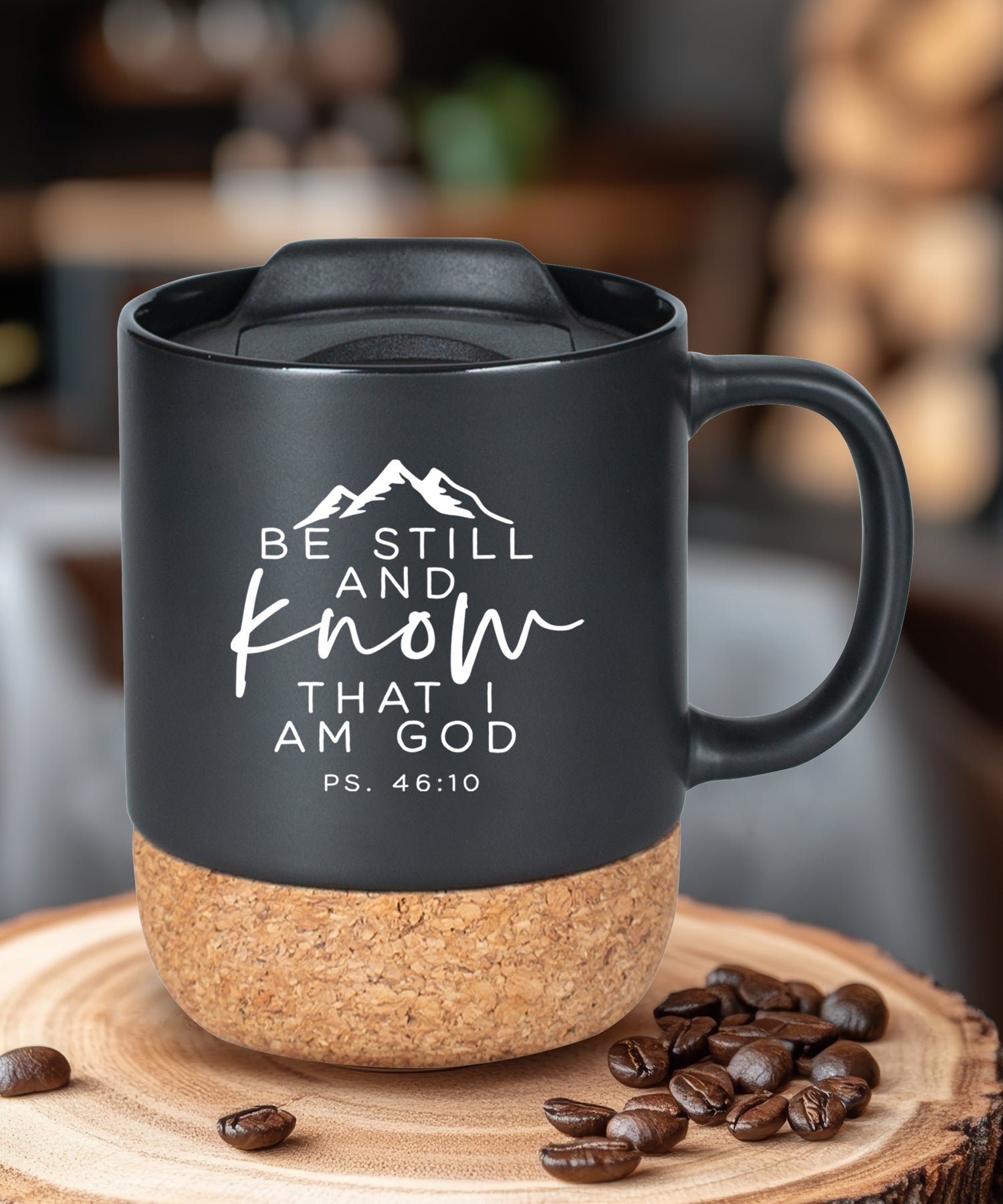Cork bottom mug with a push-on, slide-locking lid featuring Be Still.