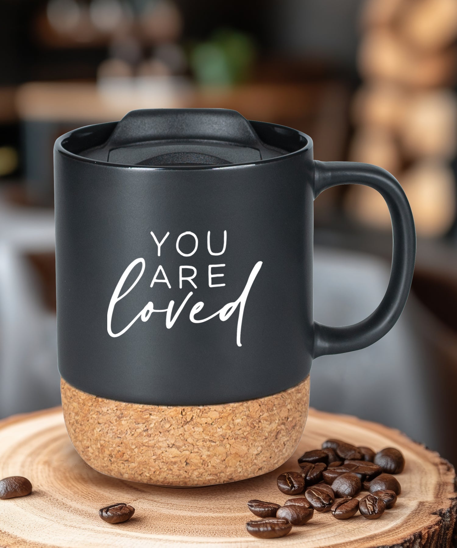 Cork bottom mug with a push-on, slide-locking lid featuring You Are Loved.