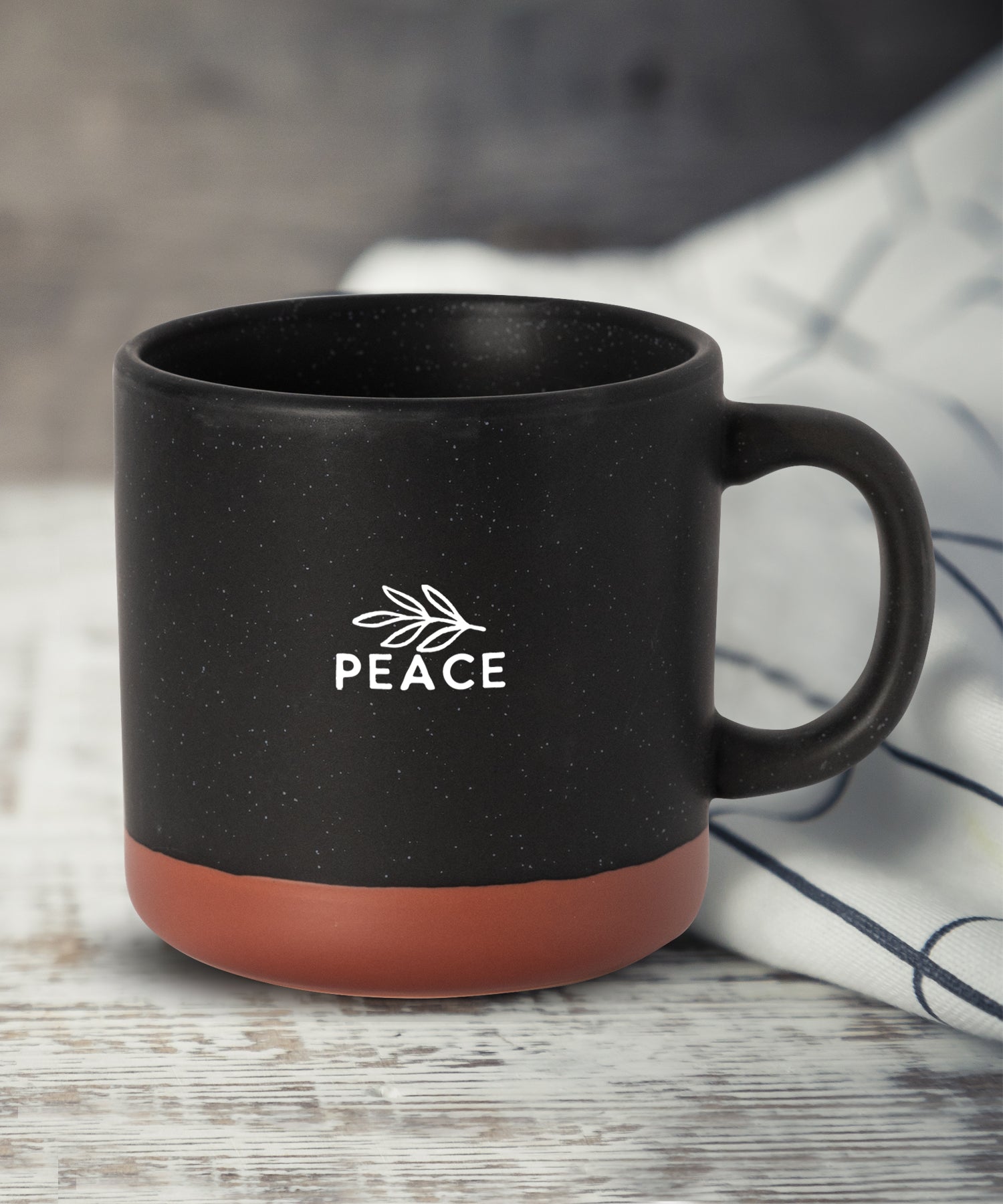 Peace Hearthside ceramic mug with speckled finish, natural baked bottom, and faith-inspired message, 14 oz
