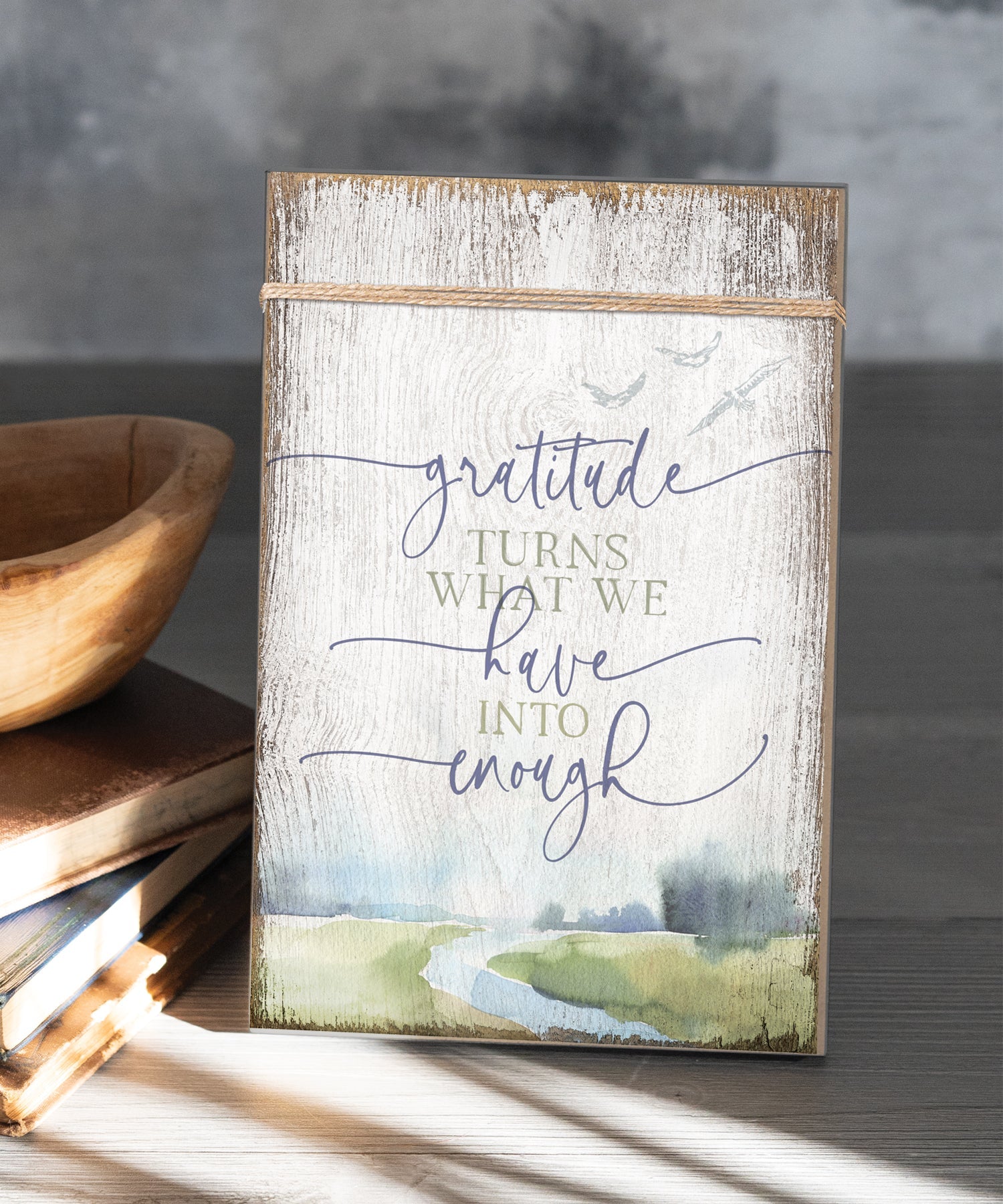 Gratitude Turns 6x9 MDF Plaque wrapped with twine for a modern farmhouse look. It features full-color printing and a keyhole for easy hanging.