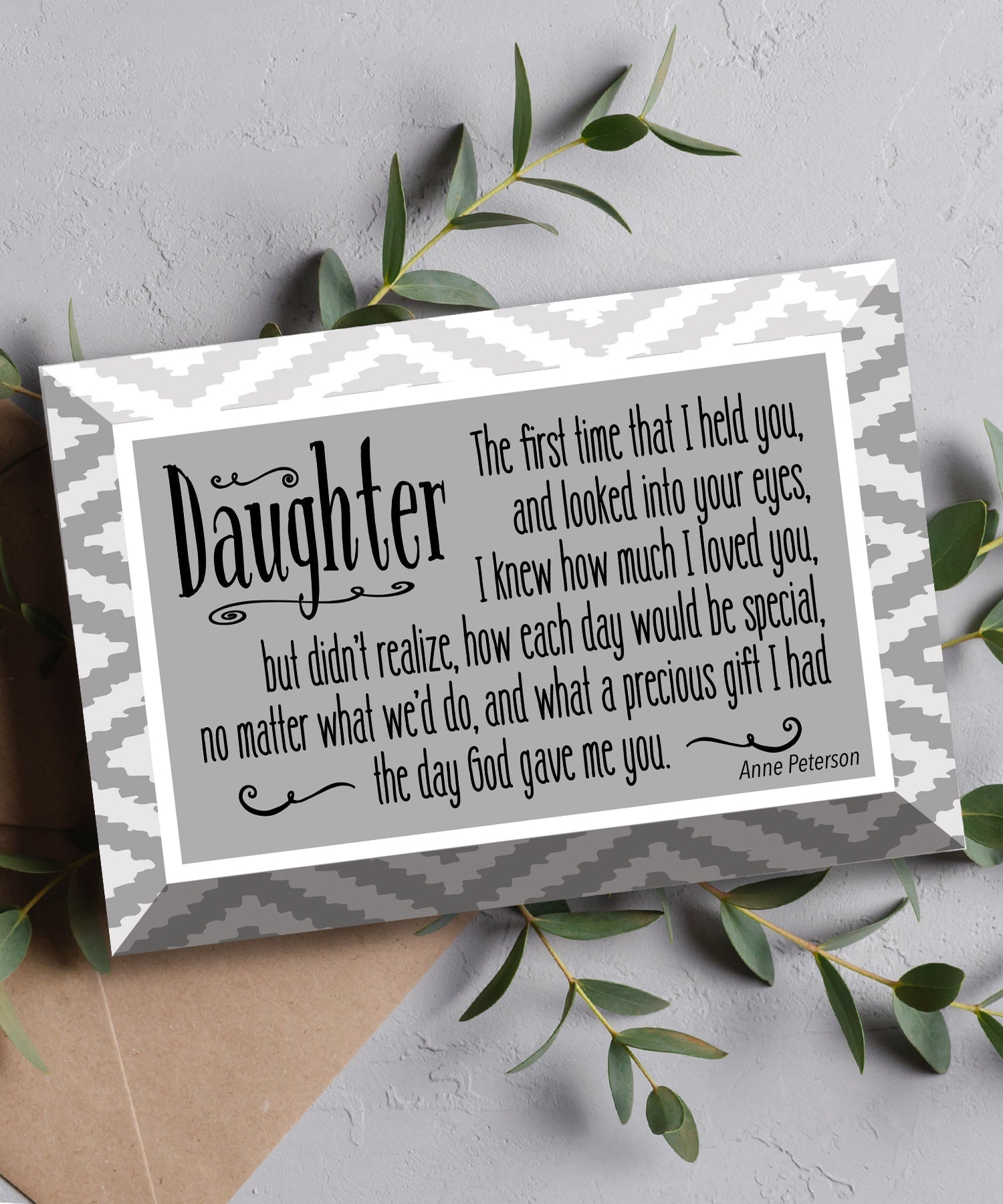Daughter Glass Plaque, which has smooth beveled edges and a screen-printed design, is perfect for display on a shelf.