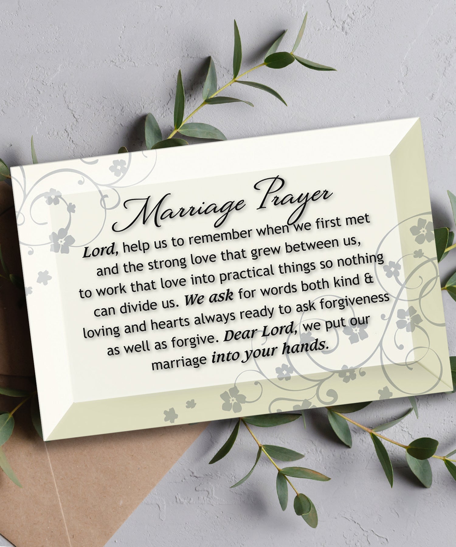 Marriage Prayer Glass Plaque, which has smooth beveled edges and a screen-printed design, is perfect for display on a shelf.