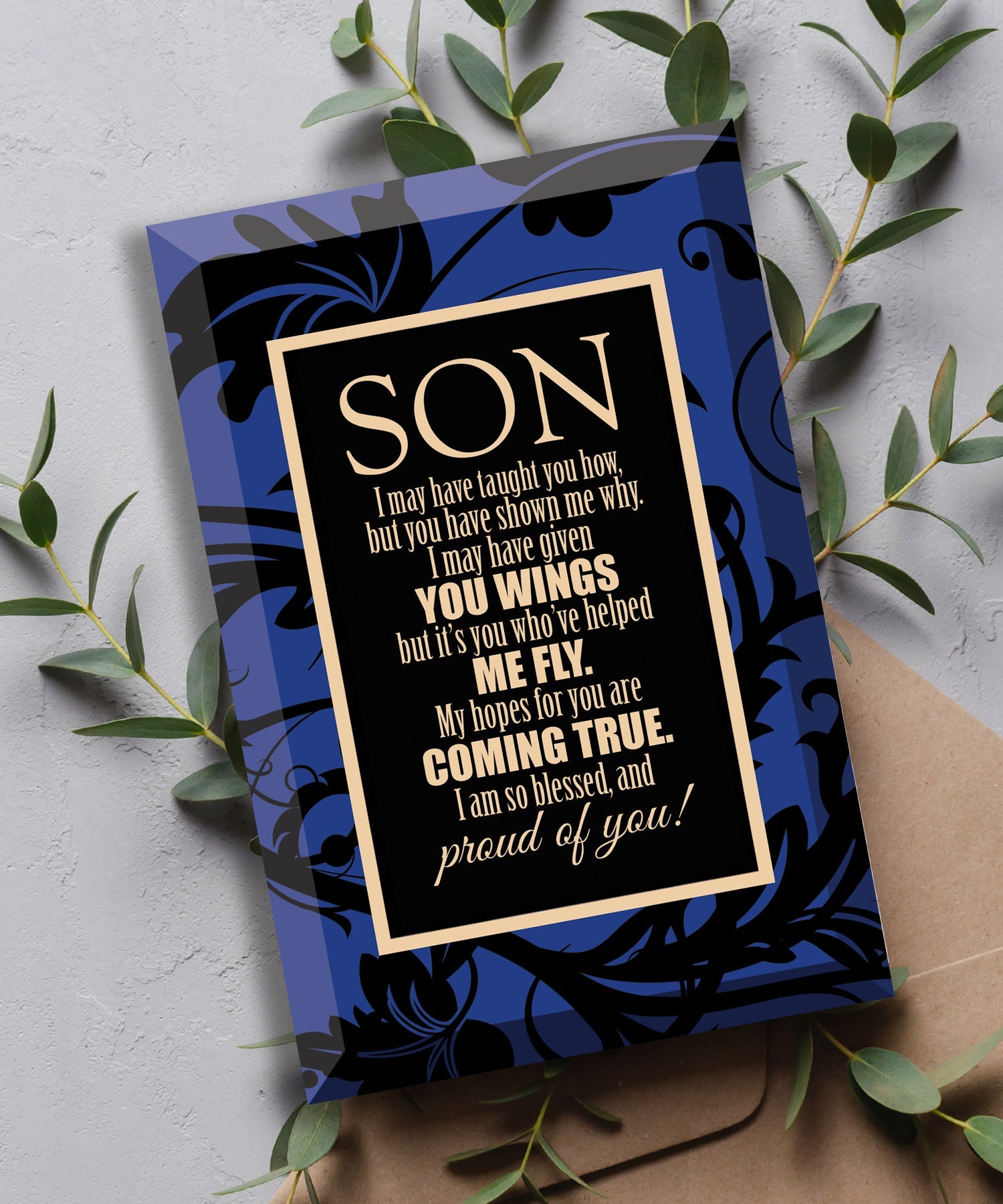 Son Glass Plaque, which has smooth beveled edges and a screen-printed design, is perfect for display on a shelf.