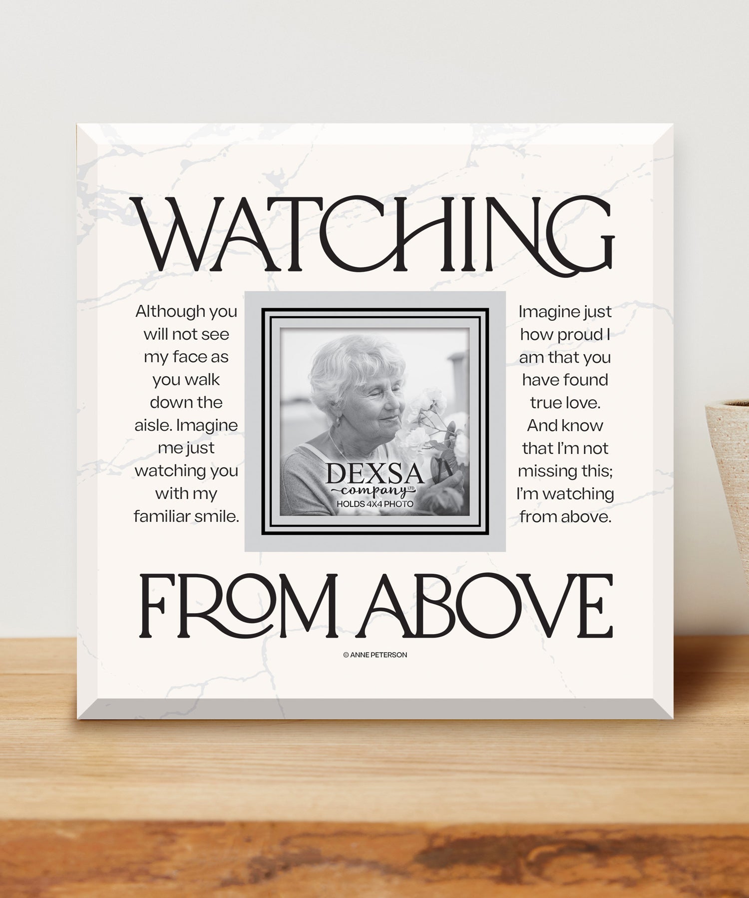 Watching From Above 12x12 Glass Photo Frame with smooth beveled edges, holding a 4x4 photo, displayed on a shelf.