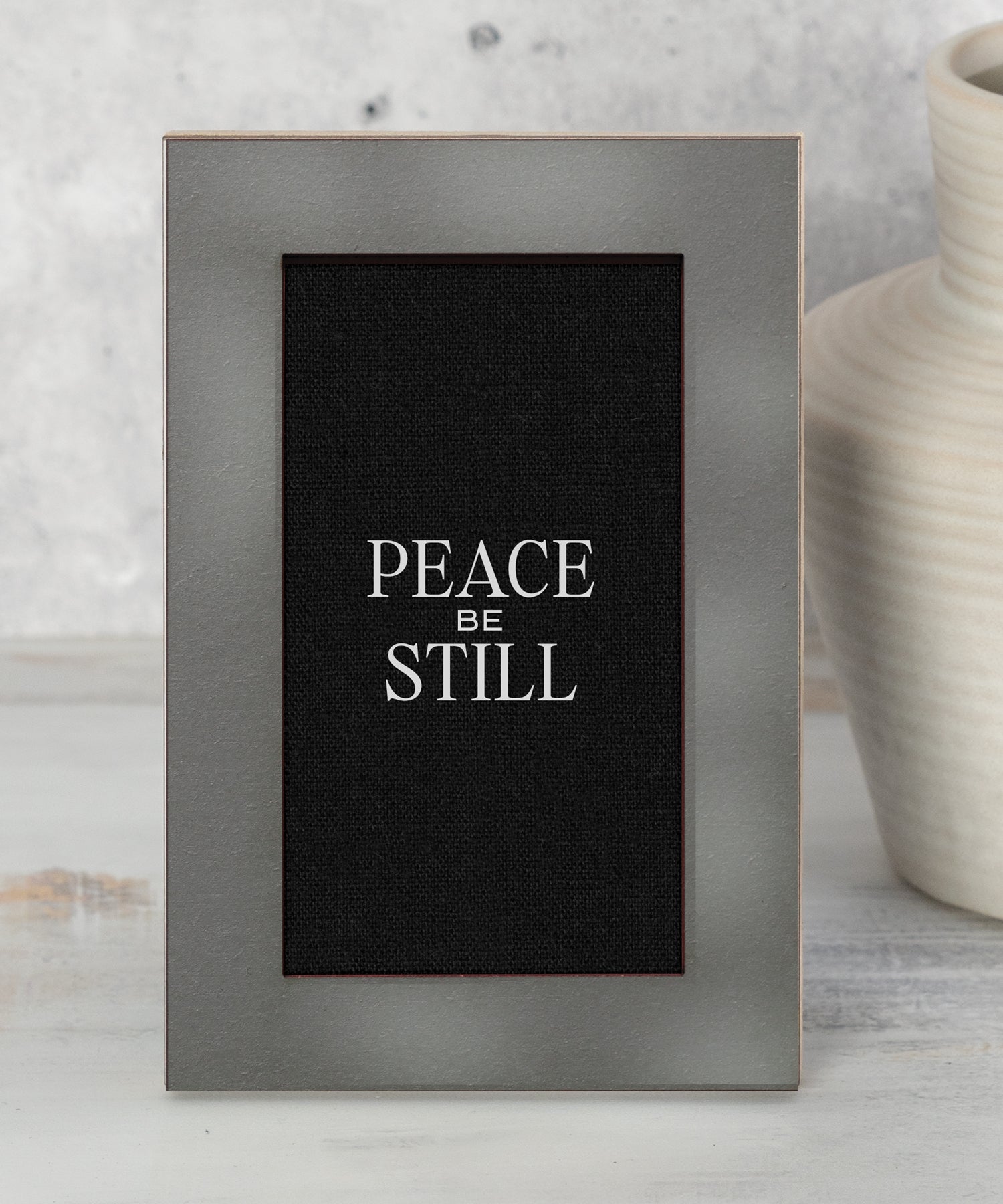 Modern Grace Peace Be Still 4x6 MDF tabletop plaque with charcoal layered frame and black linen background