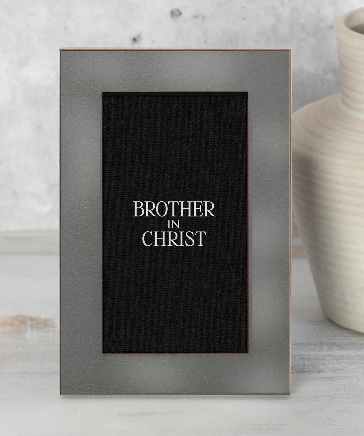 Modern Grace Brother in Christ 4x6 MDF tabletop plaque with charcoal layered frame and black linen-inspired background