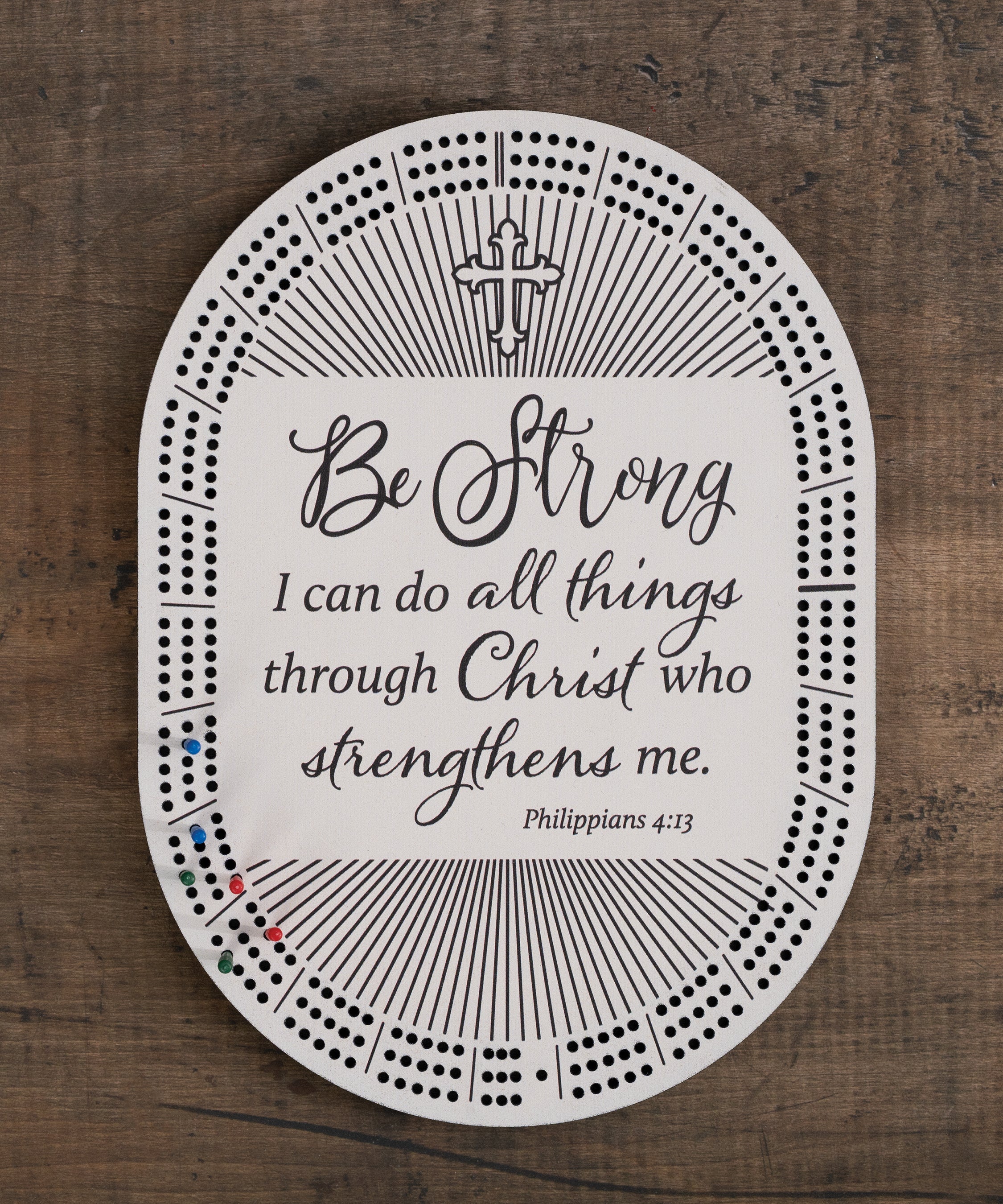 Be Strong cribbage board with inspirational cross design, beige color, and built-in peg storage