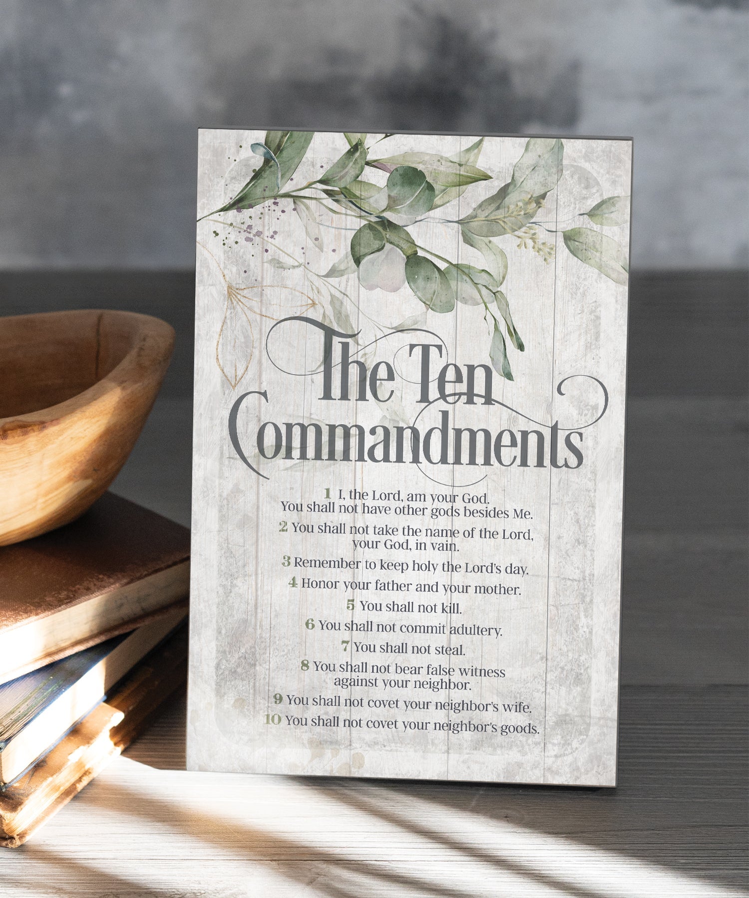 The Ten Commandments 6x9 MDF Plaque has natural edges, muted tones, and an inspirational message reflecting our faith in God. The plaque features full-color printing and a metal hanger and easel back.