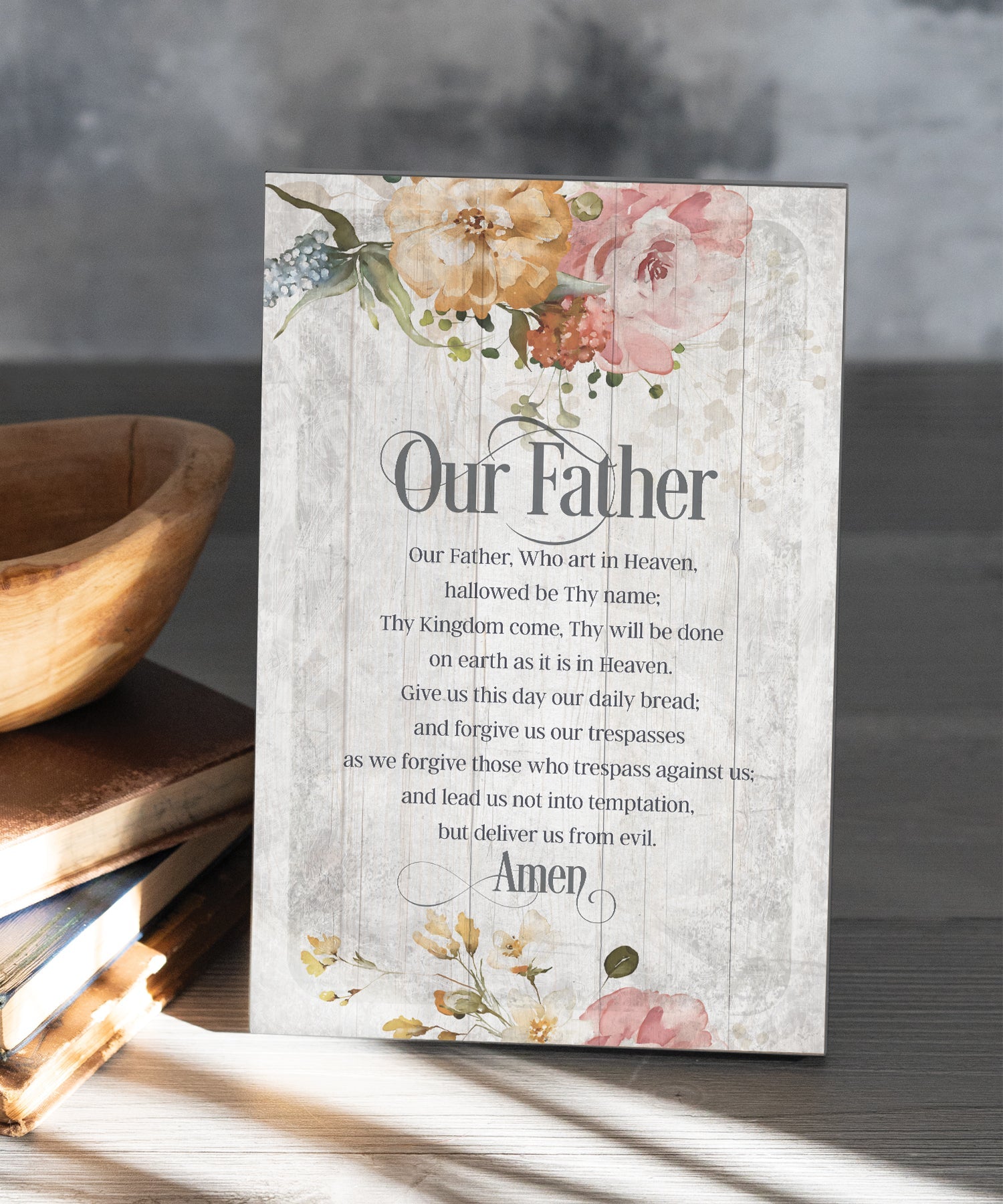 Our Father 6x9 MDF Plaque has natural edges, muted tones, and inspirational prayer reflecting our faith in God. The plaque features full-color printing and a metal hanger and easel back.