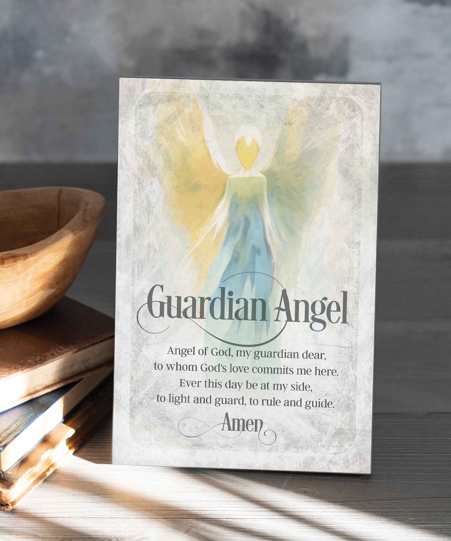 Guardian Angel Prayer 6x9 MDF Plaque has natural edges, muted tones, and an inspirational prayer reflecting our faith in God. The plaque features full-color printing and a metal hanger and easel back.