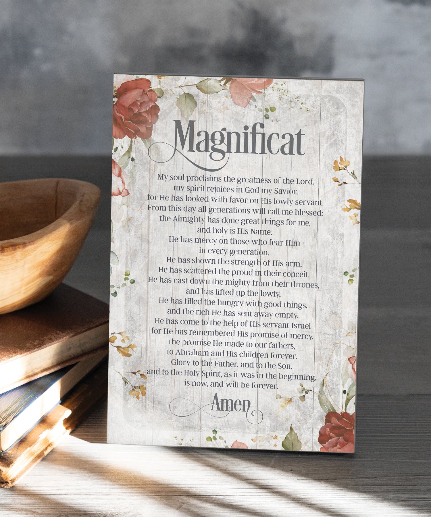 Magnificat Prayer 6x9 MDF Plaque has natural edges, muted tones, and an inspirational prayer reflecting our faith in God. The plaque features full-color printing and a metal hanger and easel back.