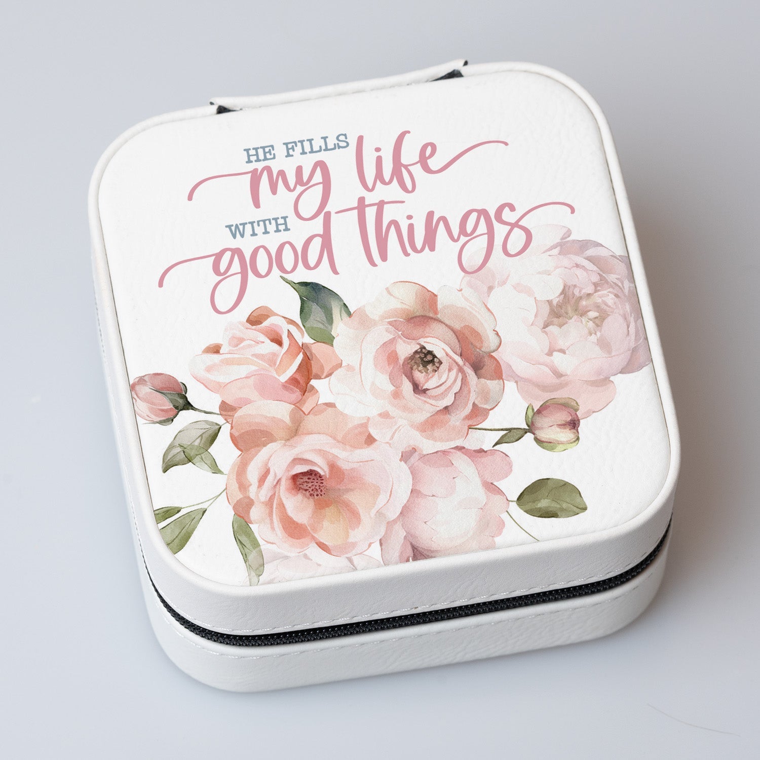 He Fills My Life Travel Jewelry Case in off-white leatherette with a zipper closure and plush black velvet interior.