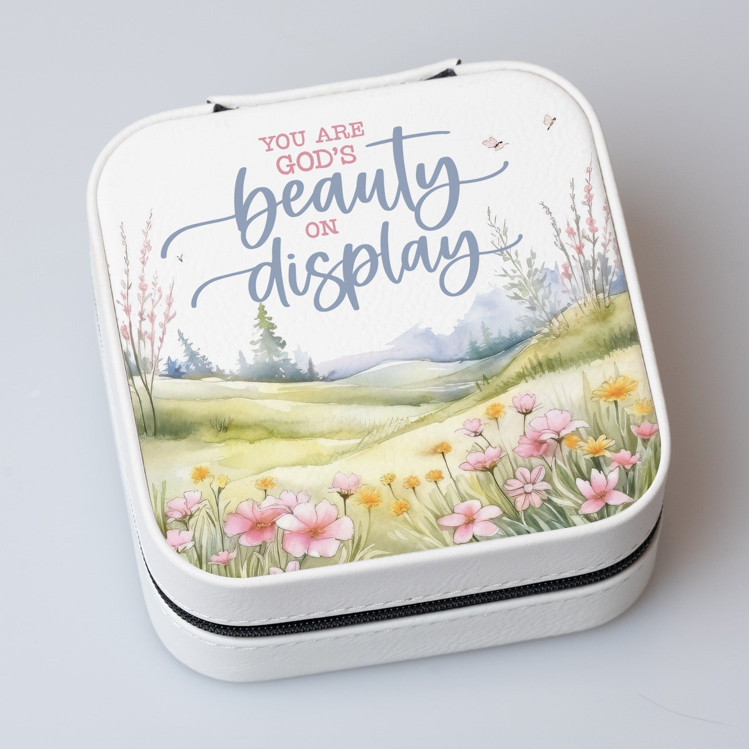 You Are God’s Beauty Travel Jewelry Case in off-white leatherette with a zipper closure and plush black velvet interior.
