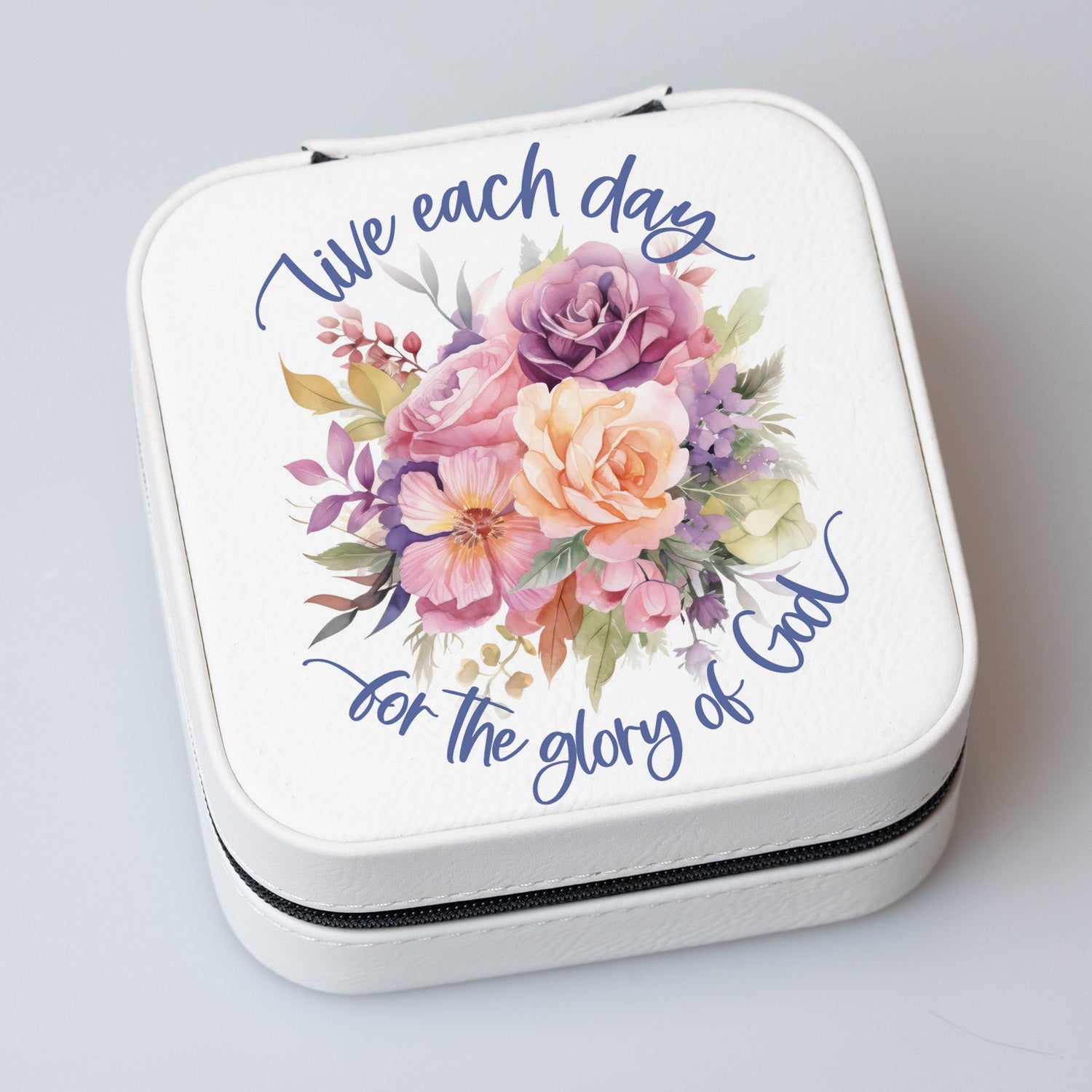 Live Each Day Travel Jewelry Case in off-white leatherette with a zipper closure and plush black velvet interior.