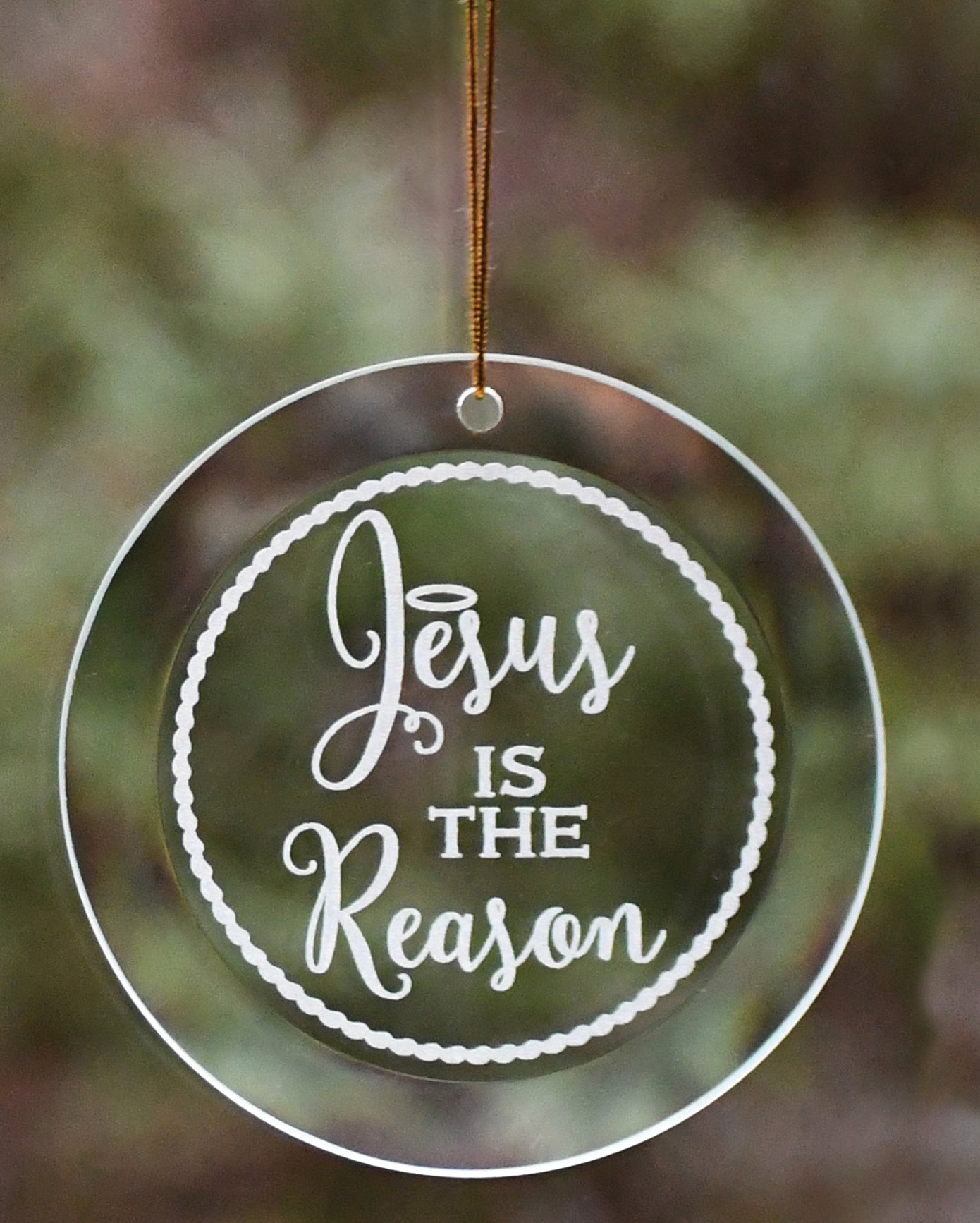 Jesus Is the Reason Ornament with laser-etched design and gold string hanger, perfect for Christmas décor
