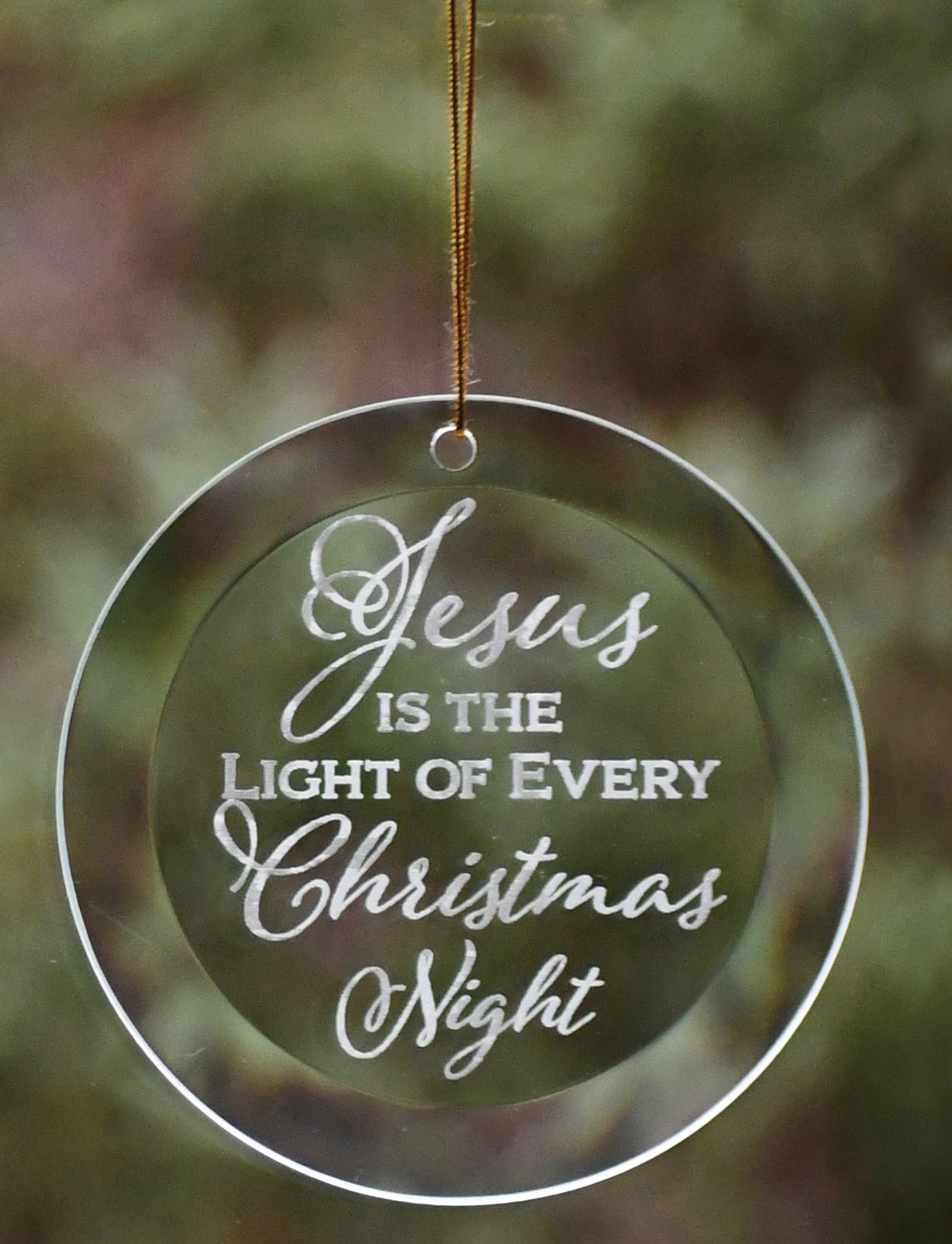 Jesus Is the Light Glass Ornament with laser-etched design and gold string hanger, perfect for Christmas décor