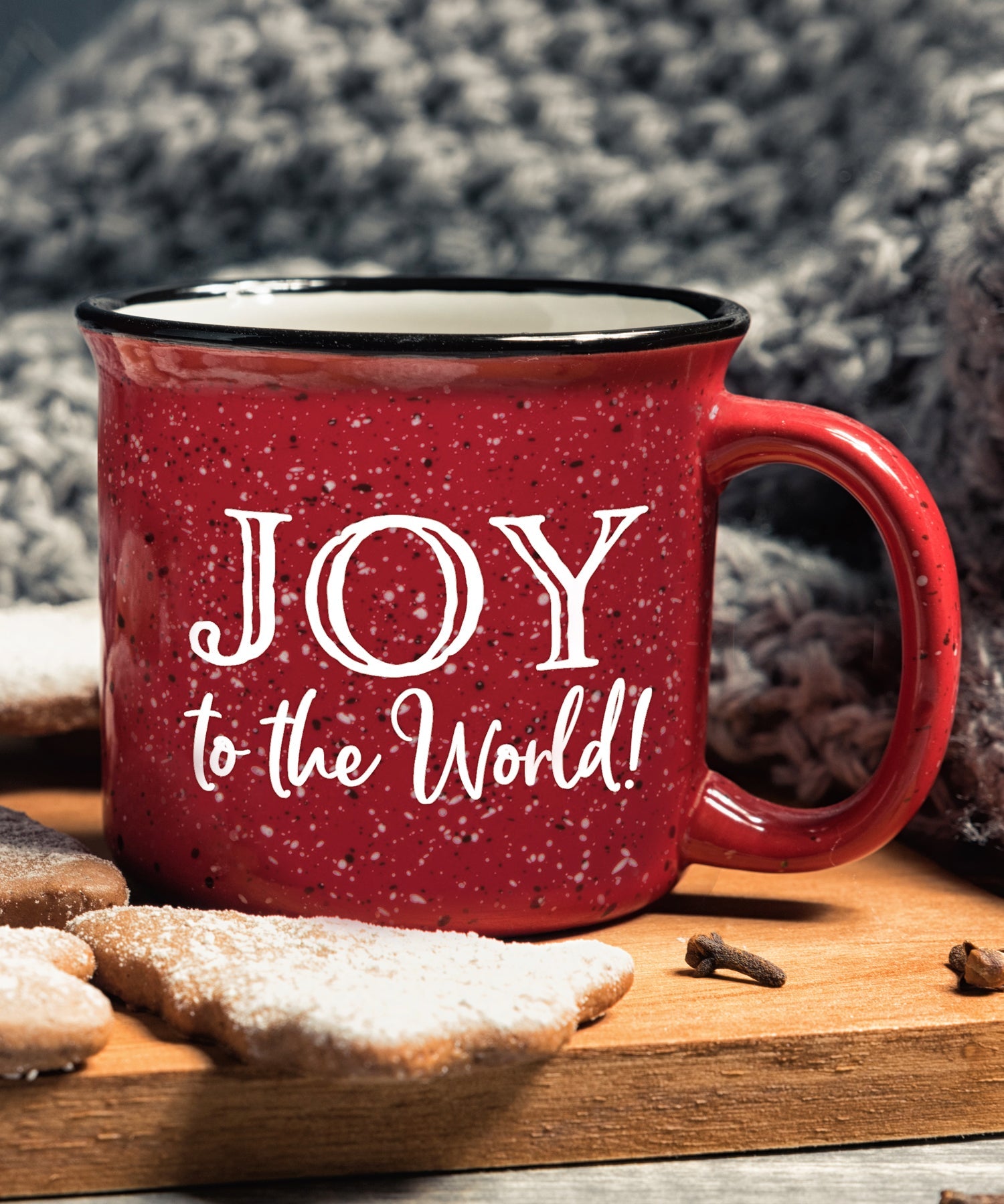 Ceramic Christmas camping mug with a design resembling a classic tin cup featuring the message Joy to the World.